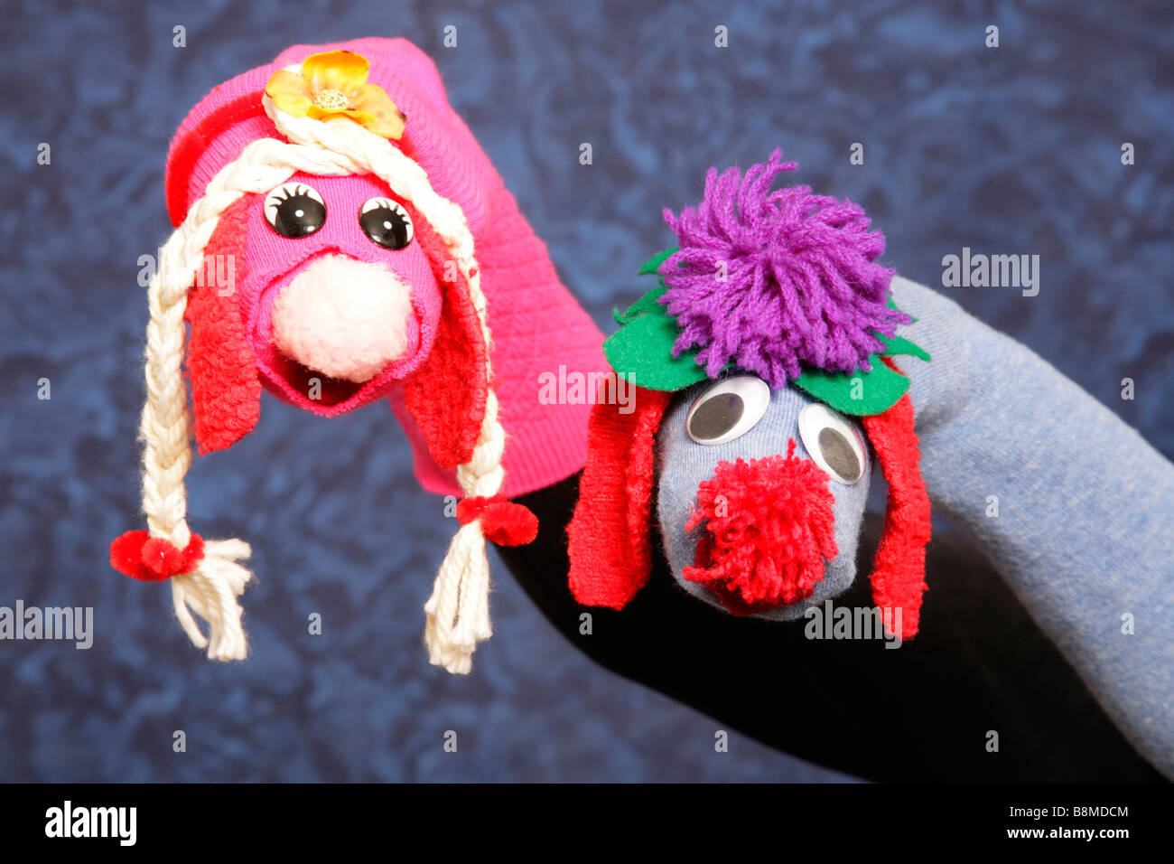 Hand manipulated pair of character puppets created from socks Stock