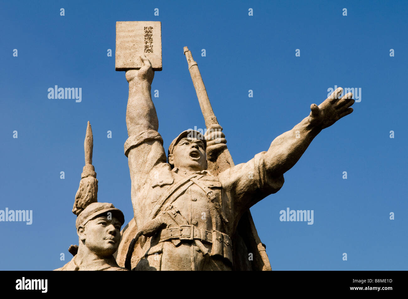The statue of this communist workers stands on the first bridge over the Yangtze river in Nanjing, Jiangsu, China. Stock Photo