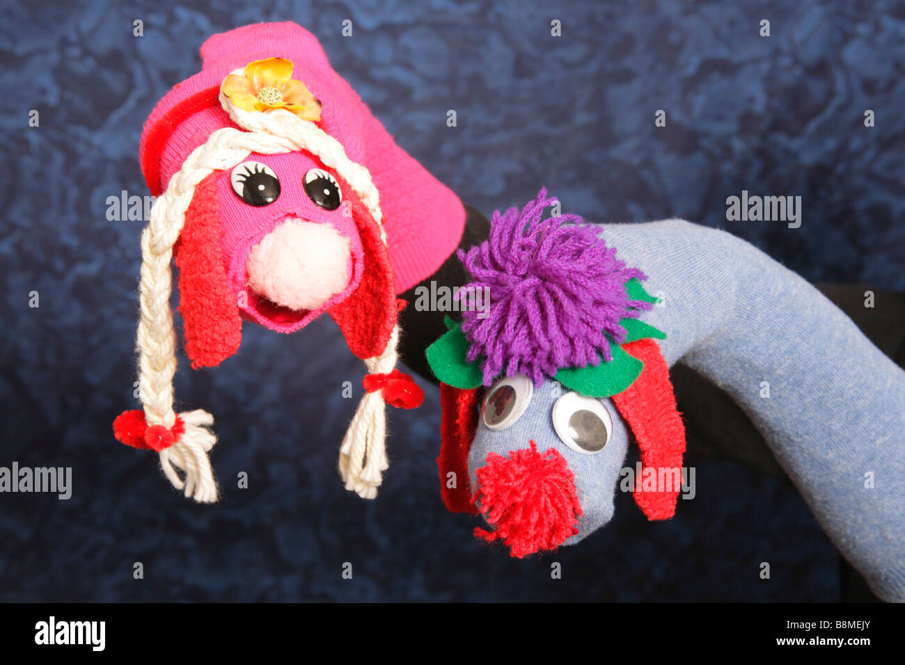 Hand manipulated character puppets created from socks. Stock Photo