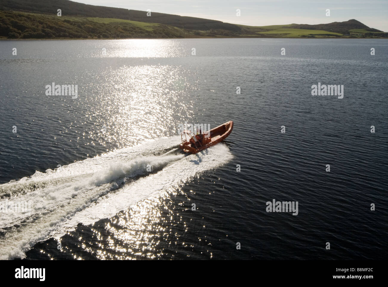photograph of fast rescue boat rib under way Stock Photo - Alamy