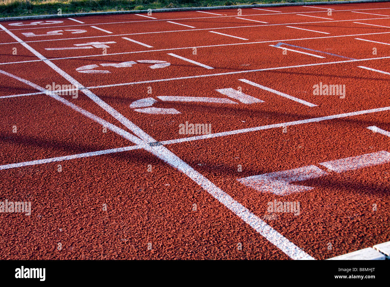 Lane numbers on running track Stock Photo Alamy