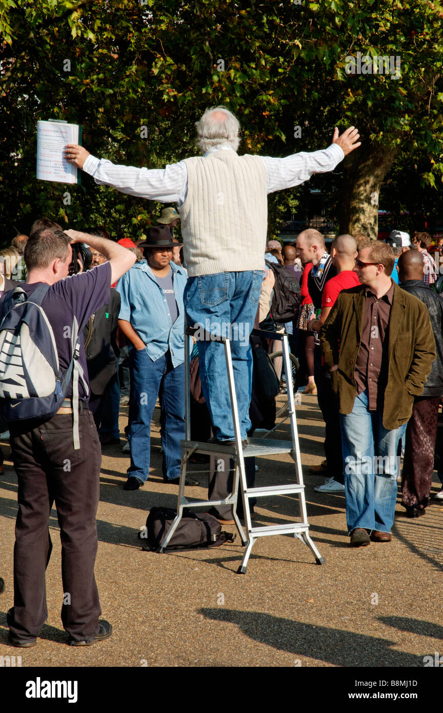 A religious speaker at Speakers Corner with arms outspread Stock Photo