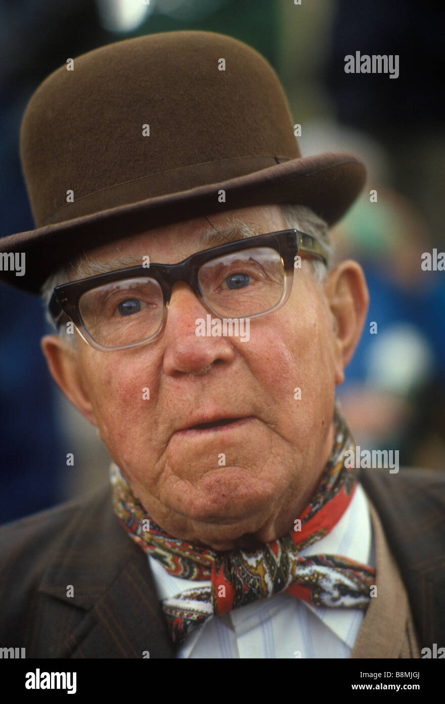 Man wearing Brown Derby bowler hat and  a traditionally tied neckerchief.  Appleby-in-Westmorland Cumbria UK 1980s 1985 HOMER SYKES Stock Photo