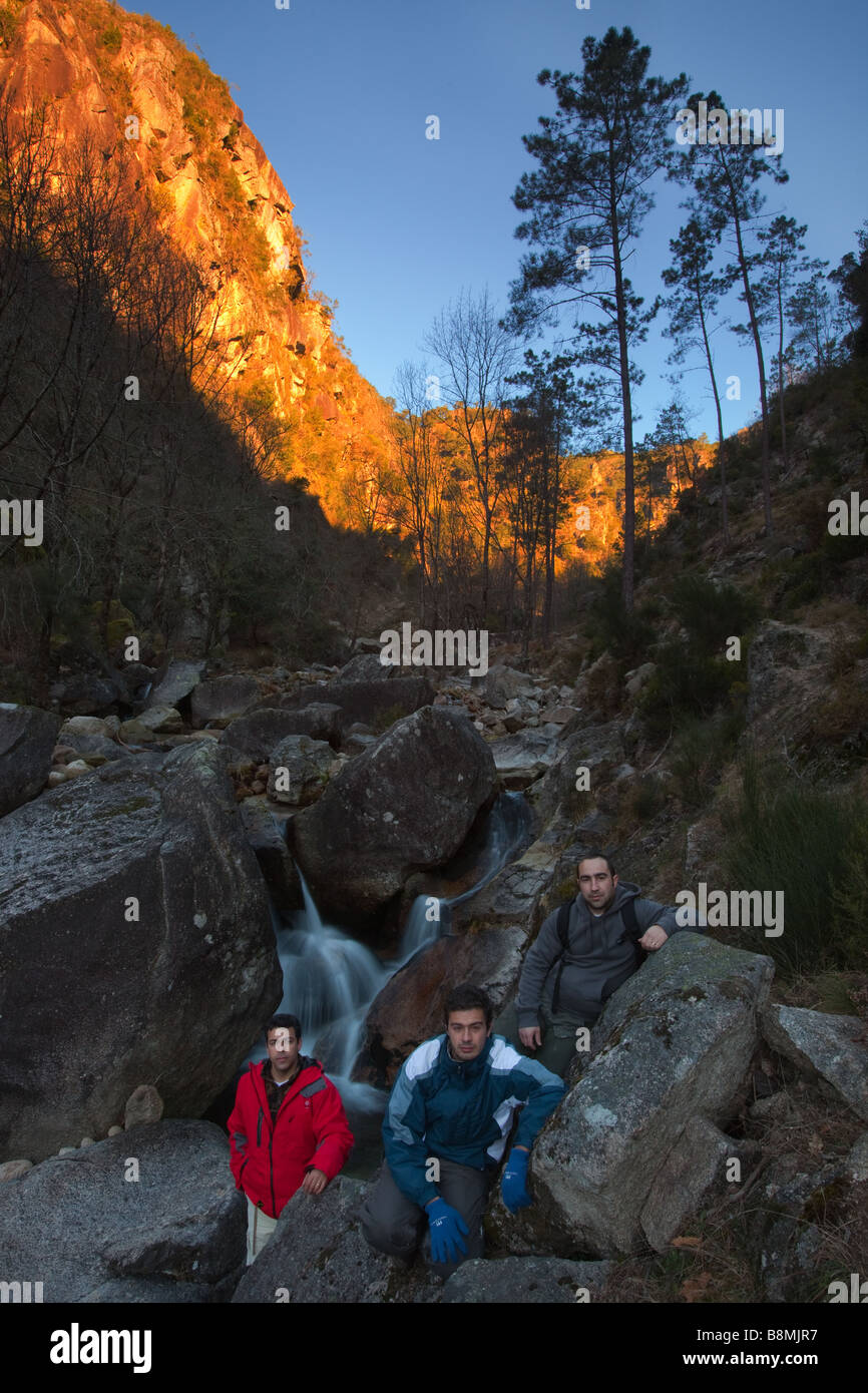 3 photographers with sunrise landscape on the background Stock Photo