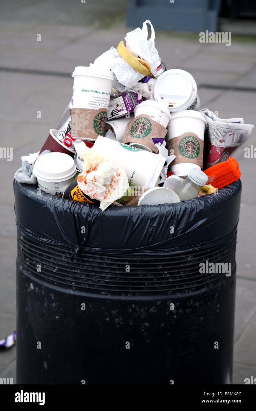 Overflowing litter bin in street, London Stock Photo