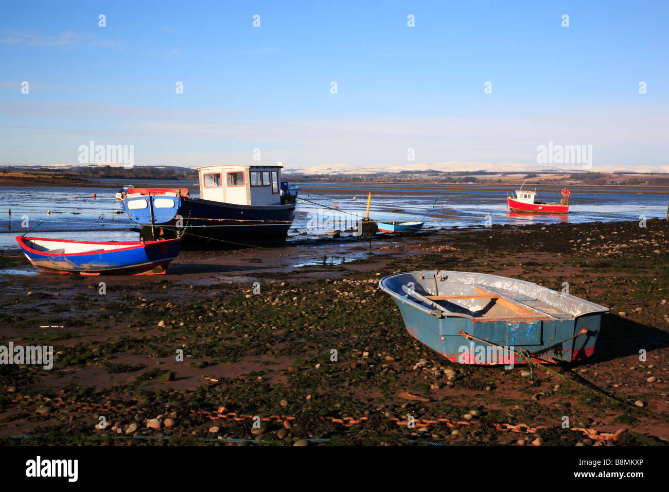 Boats at low tide, in the mud,  in Montrose Basin Angus Scotland Stock Photo