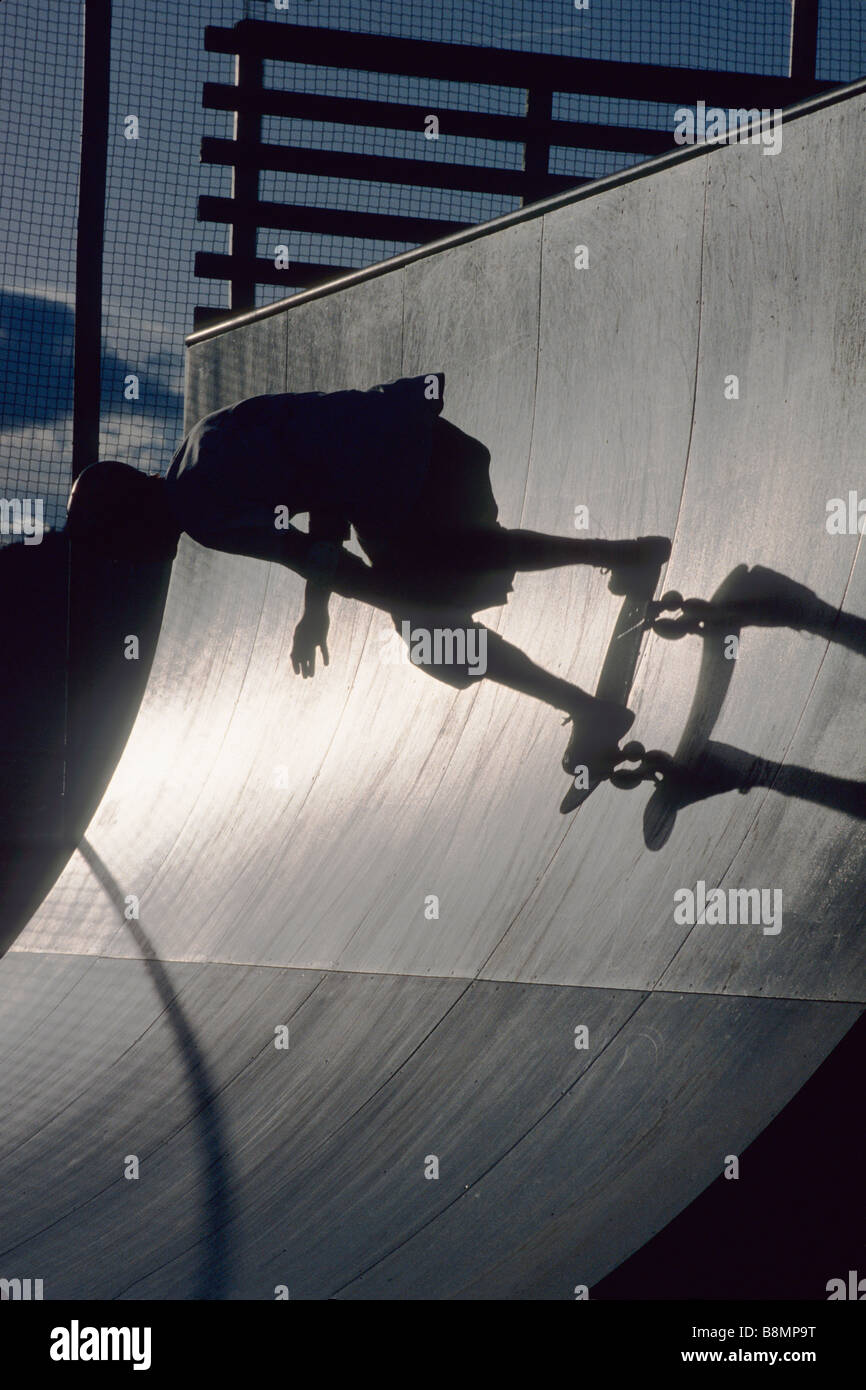 Skateboarder in action on the vert Stock Photo