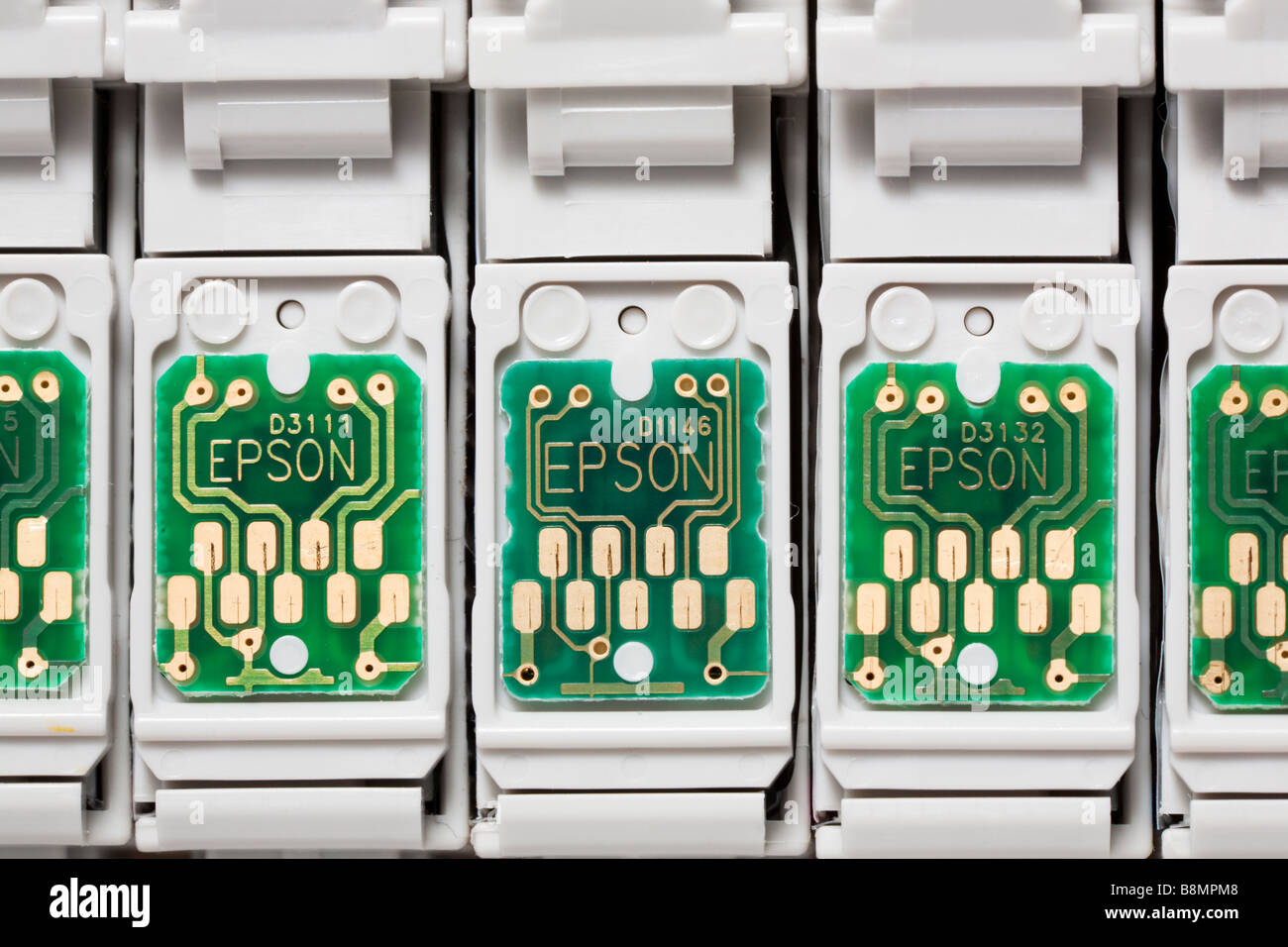 Close of Epson inkjet printer cartridges showing chip contacts Stock Photo