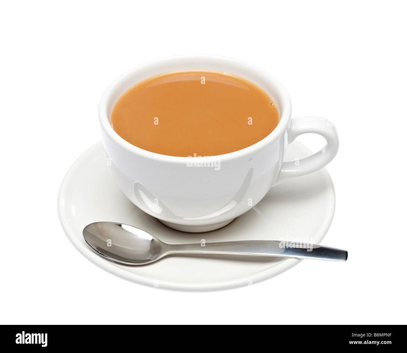 Cup of tea on saucer with spoon on white cutout, UK Stock Photo