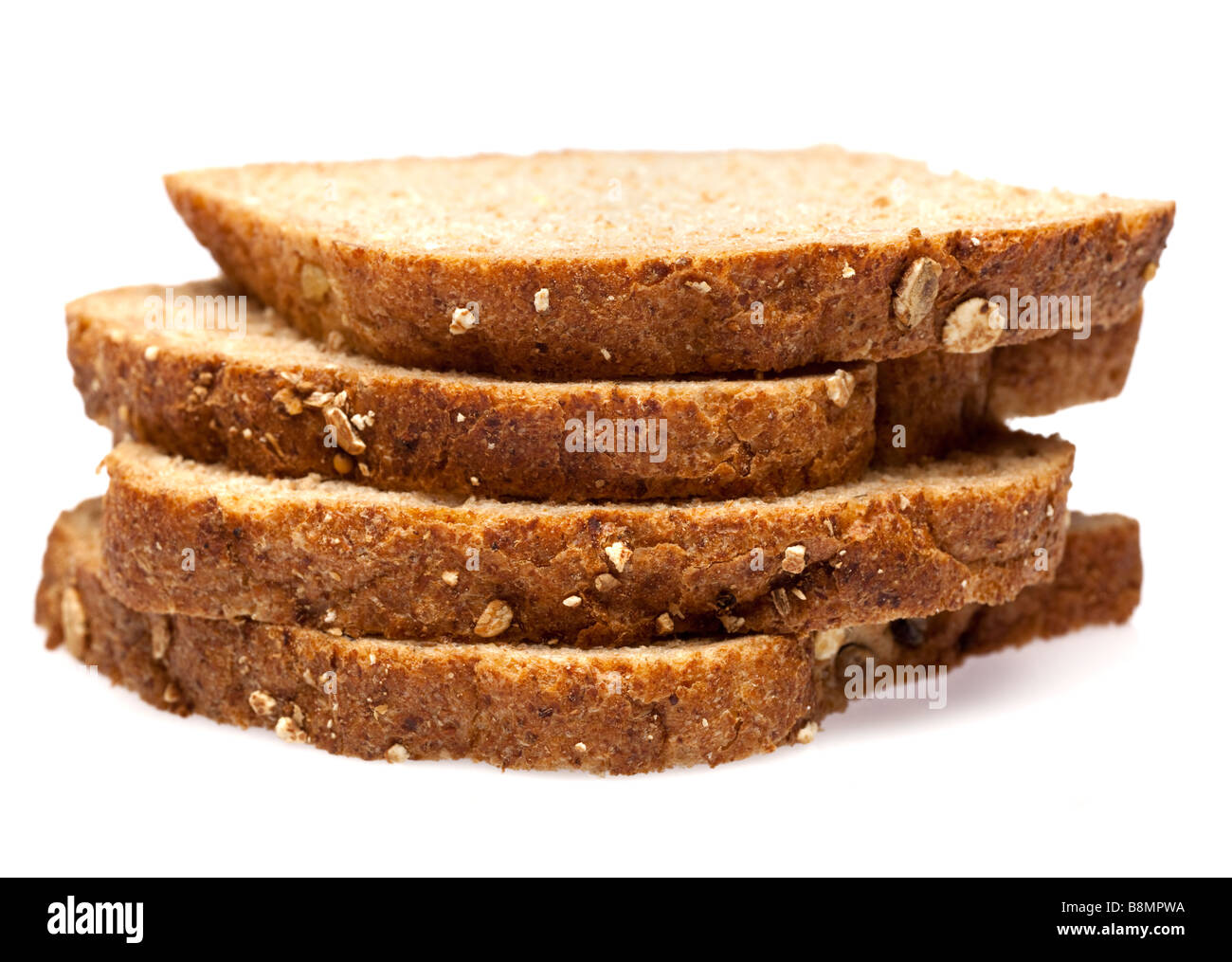 Wholemeal granary bread slices on white cutout Stock Photo