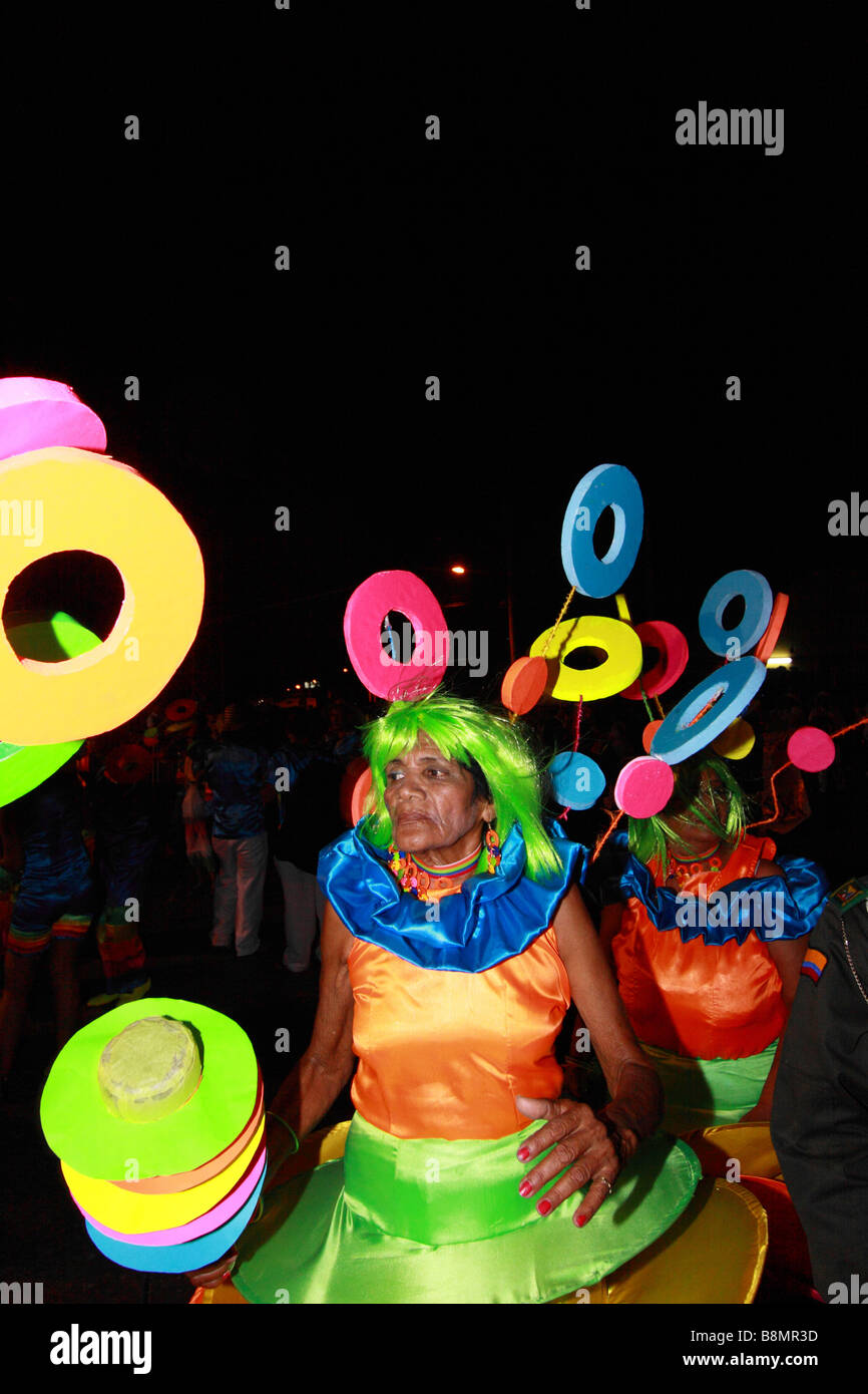 Old masked woman in the street during the Carnival of Barranquilla, Atlantico,  Colombia, South America Stock Photo