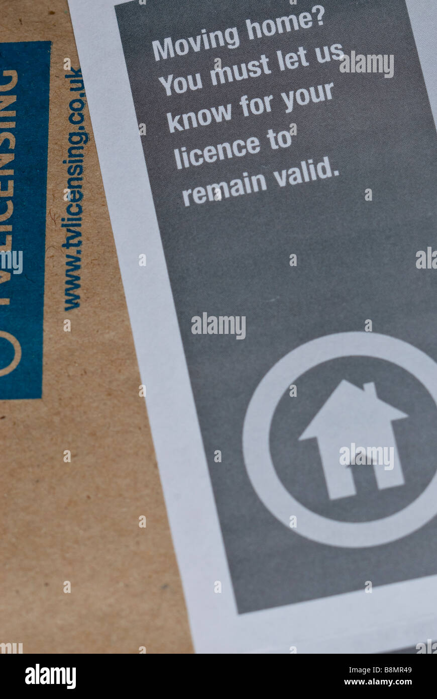 A close up of a uk tv television licence stating if you move home you must inform them for your licence to remain valid Stock Photo