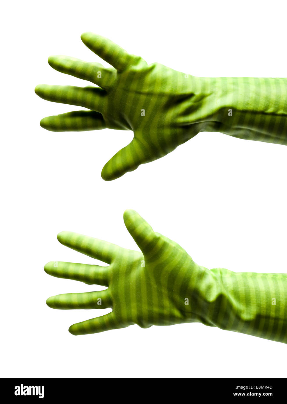 Female hands in rubber gloves stretching on white cutout MR Stock Photo