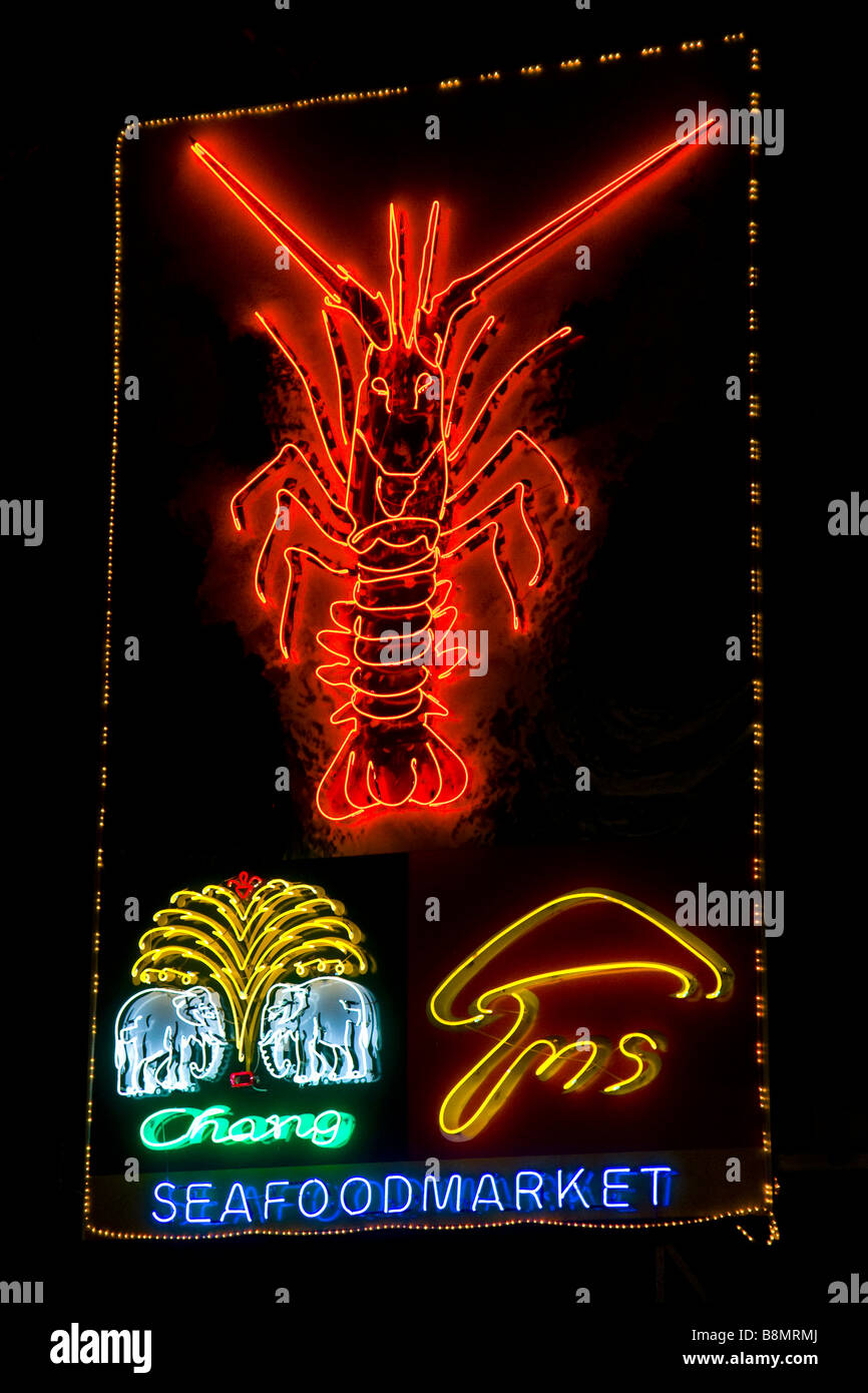 A neon sign advertising a Thai seafood market Stock Photo