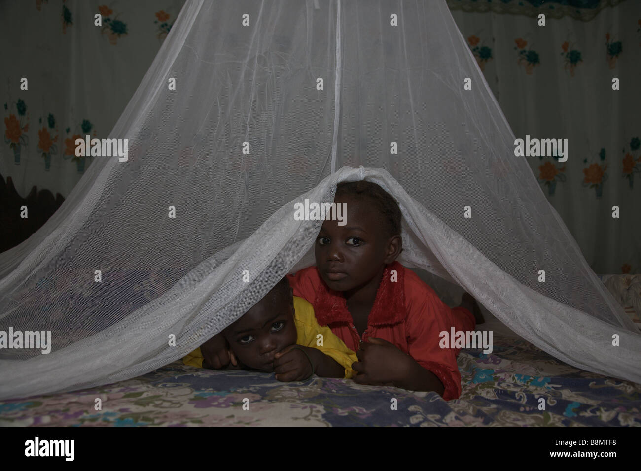 Children in Nigeria sleeps under a long lasting insecticide treated