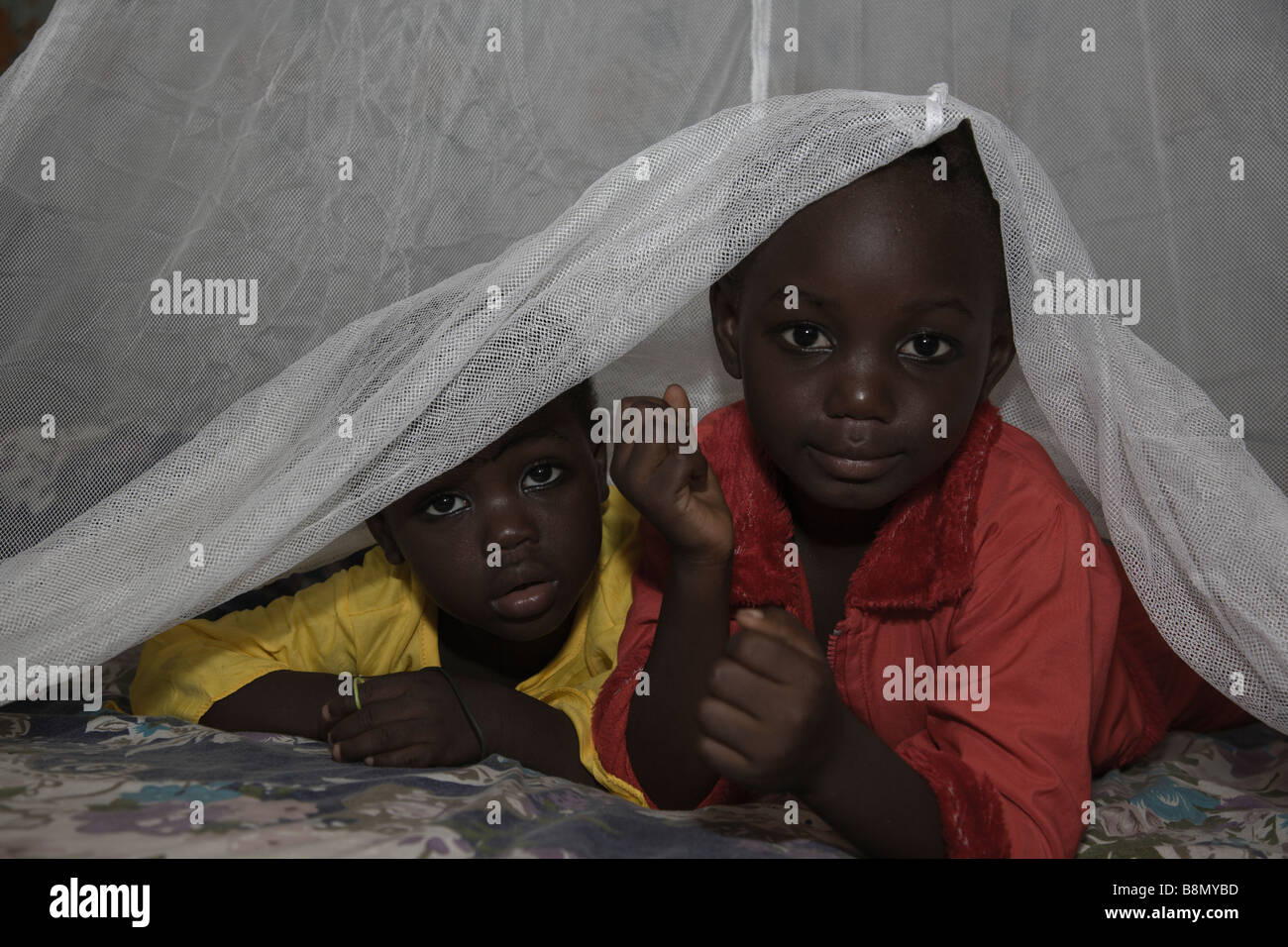 Children in Nigeria sleeps under a long lasting insecticide