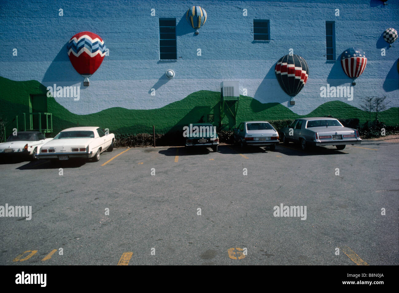 Parking lot with three dimensional graphic wall. Stock Photo