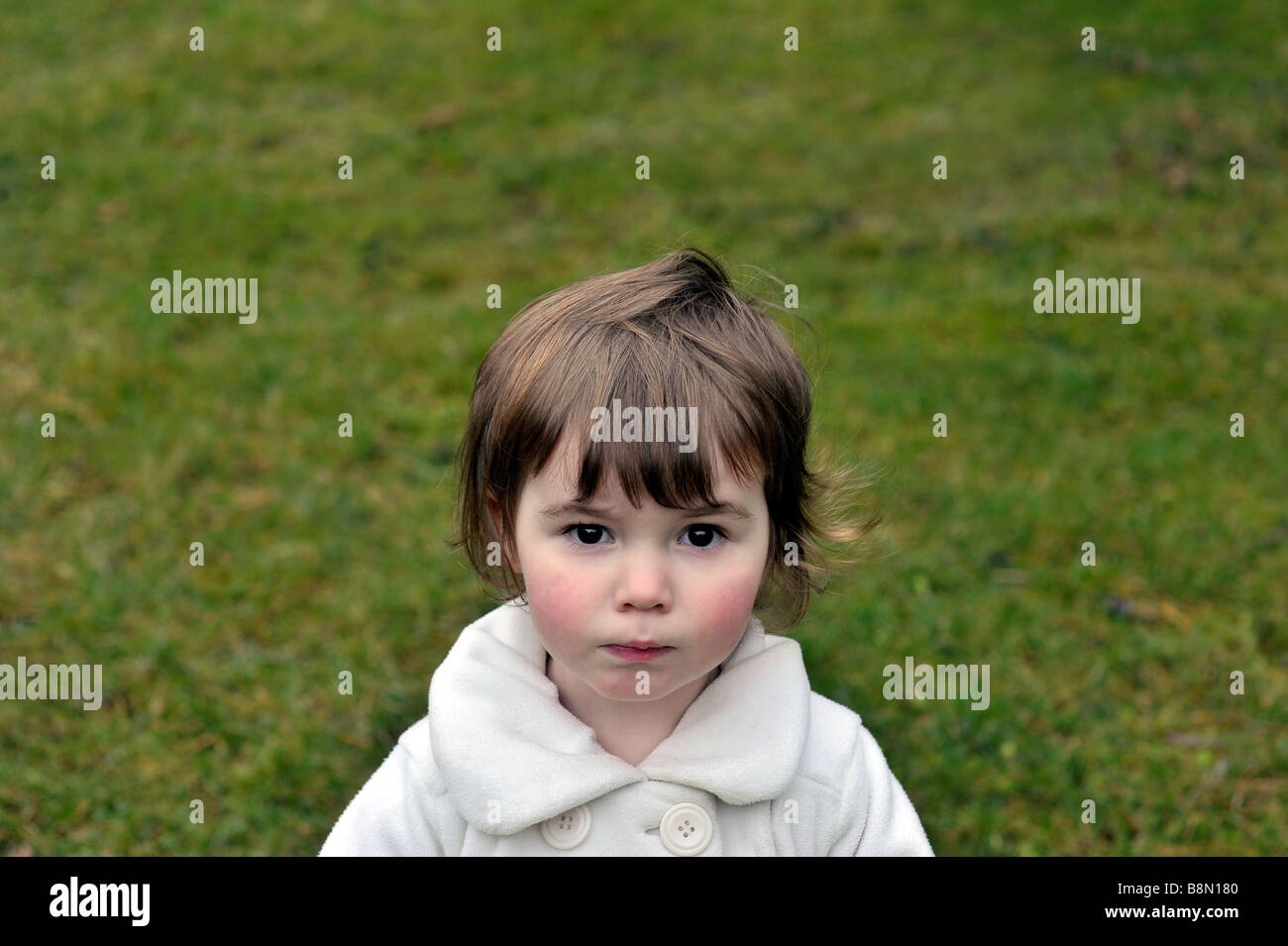 beautiful toddler girl portrait garden lawn Stock Photo