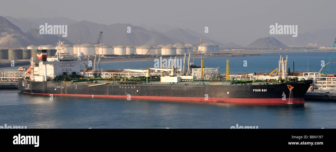 Fujairah port on the Gulf of Oman oil tanker loading from nearby refinery and storage facilities Stock Photo