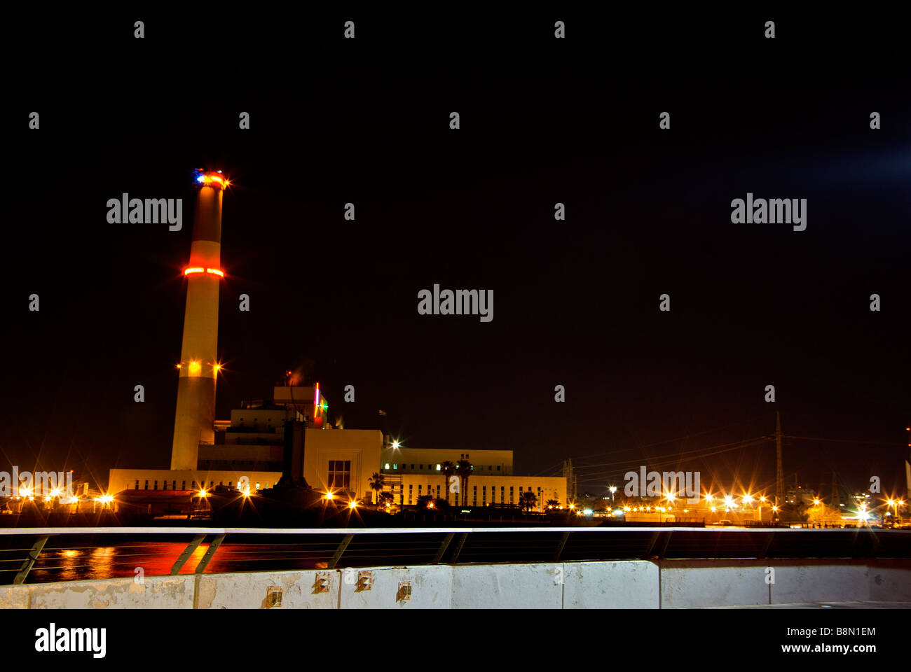 Natural gas powered Reading Power electric generating station lit up at night on Yarkon River Stock Photo