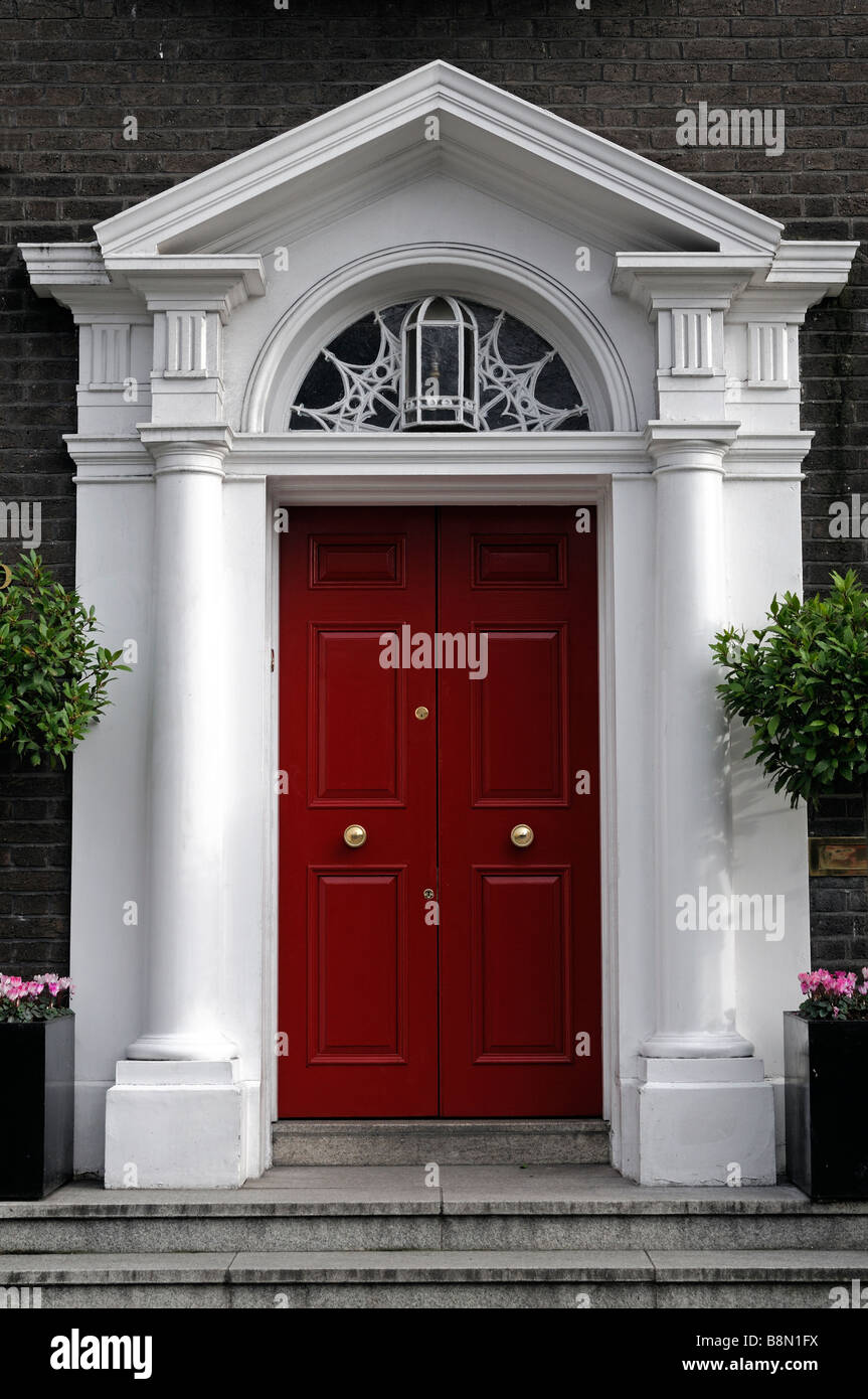 Red painted doorway door arched arch entrance formal style St saint stephens green