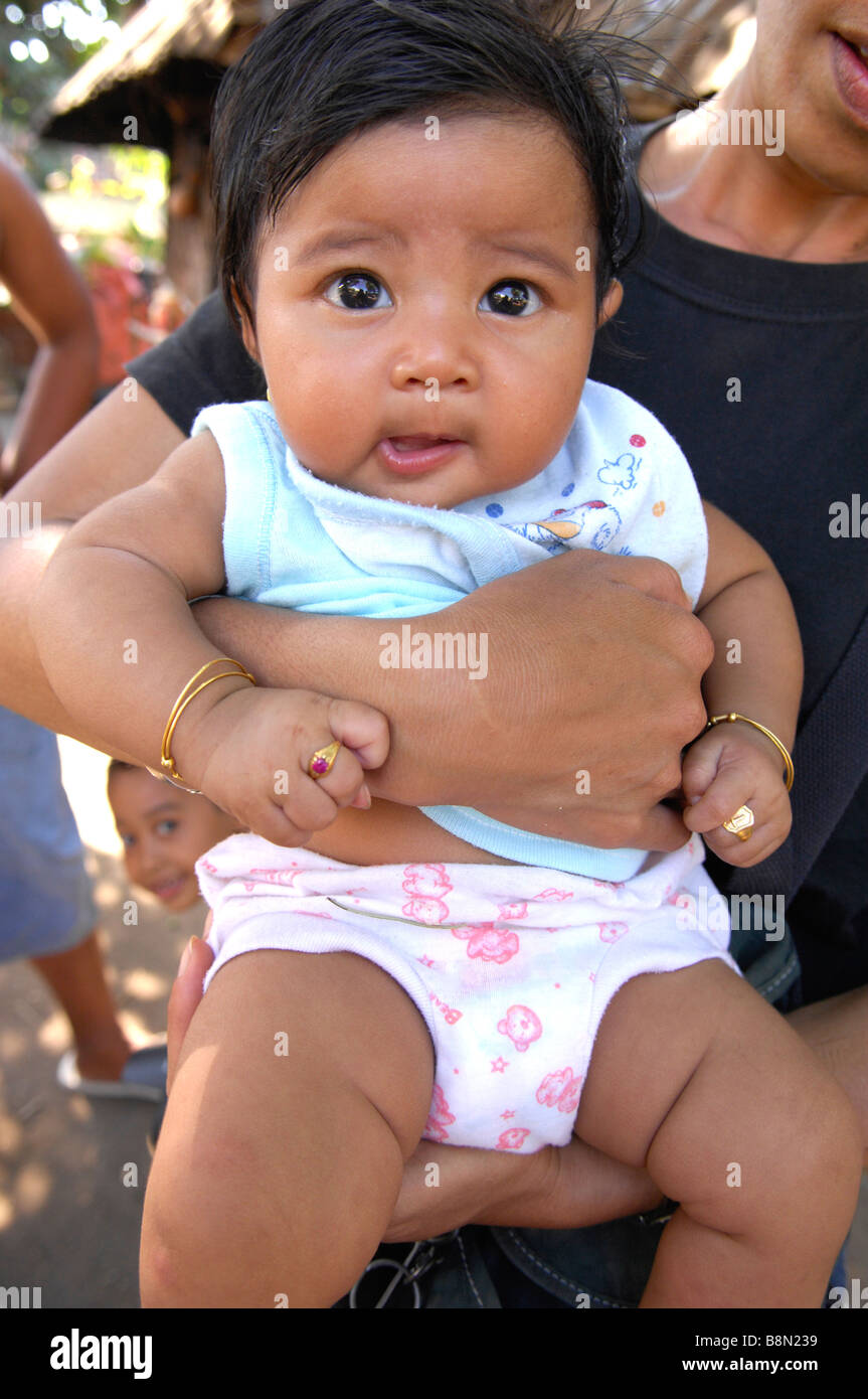 Bali Aga baby with small ring on her little fingers,Bali,Indonesia Stock Photo Alamy