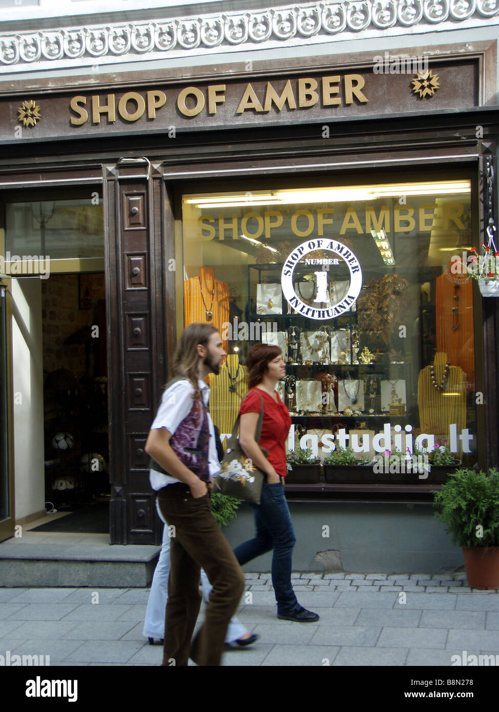 Amber Shop and Young Locals in the Old Town of Vilnius in Lithuania Stock Photo