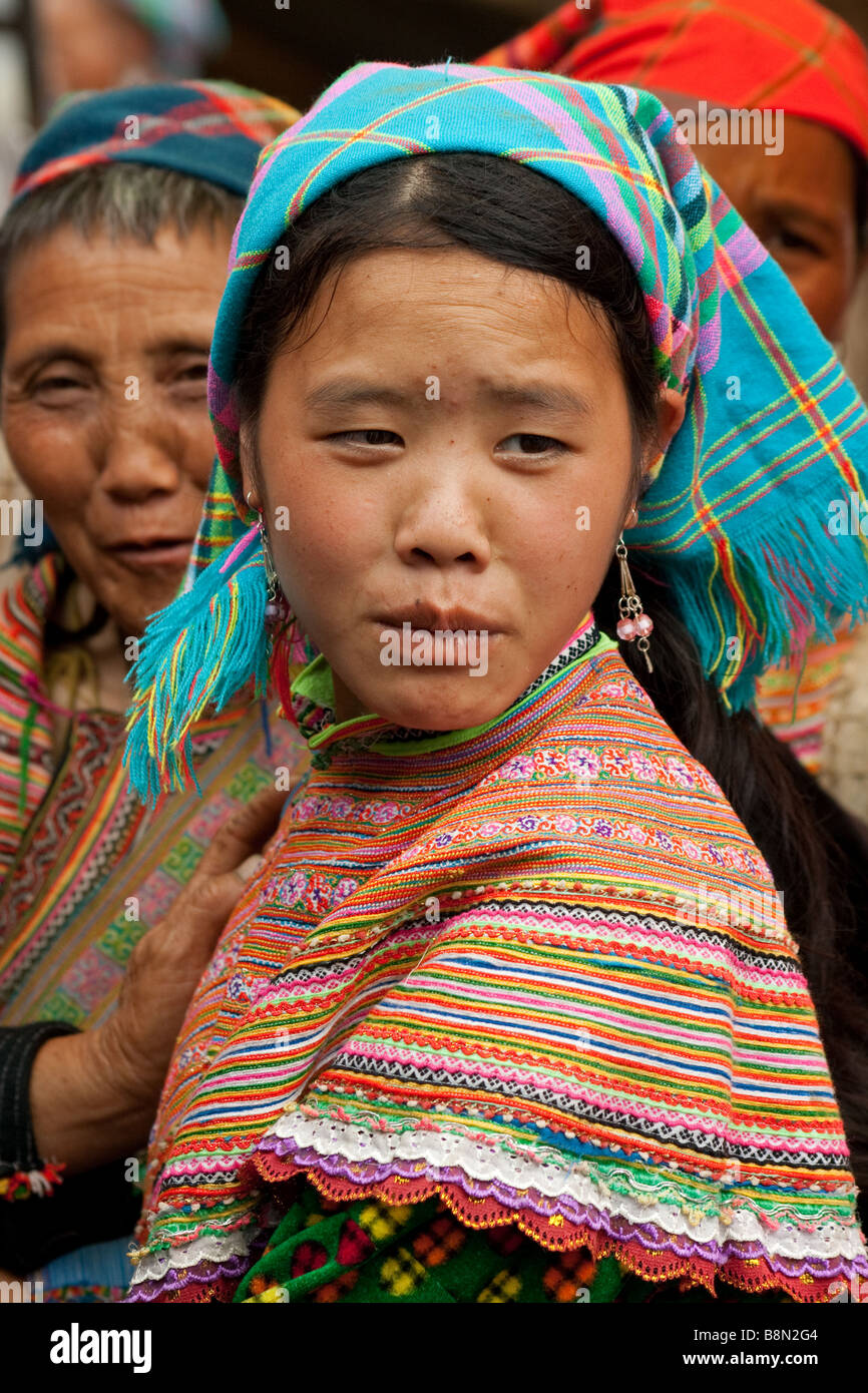 Portrait of a flower H'mong tribal girl in costume. The Bac Ha market day is a famous cultural event with ethnic minorities in a tribal gathering Stock Photo