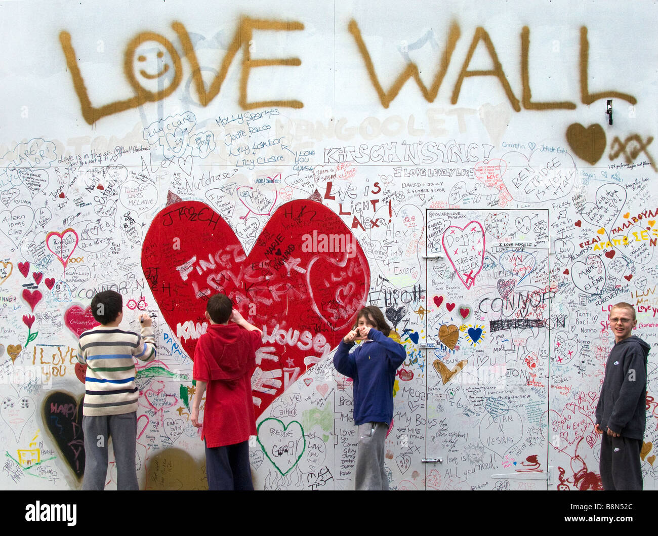 Children write on 'Love Wall' Stock Photo Alamy