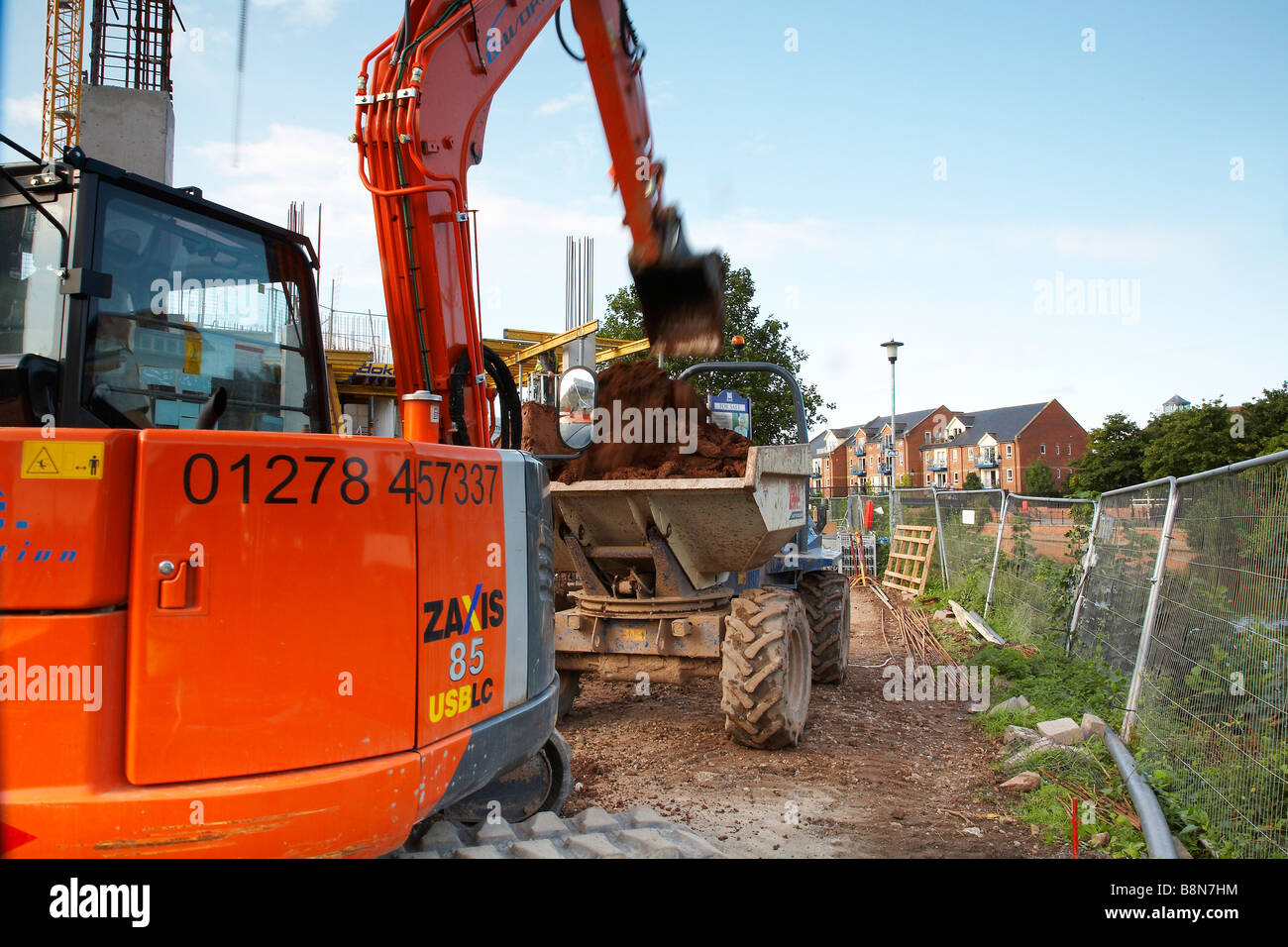 Construction of new apartments at taunton cricket club. Jcb loading a