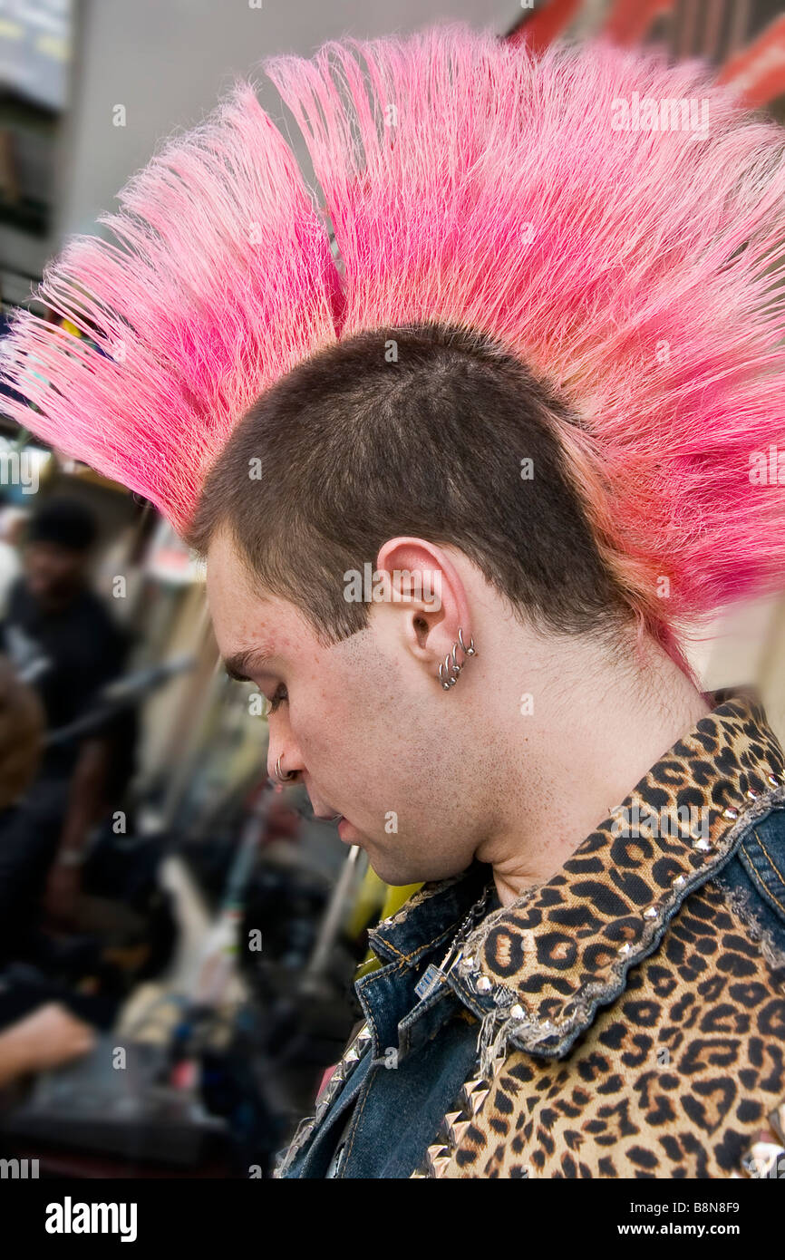 Young punk with pink Mohawk hairstyle Stock Photo