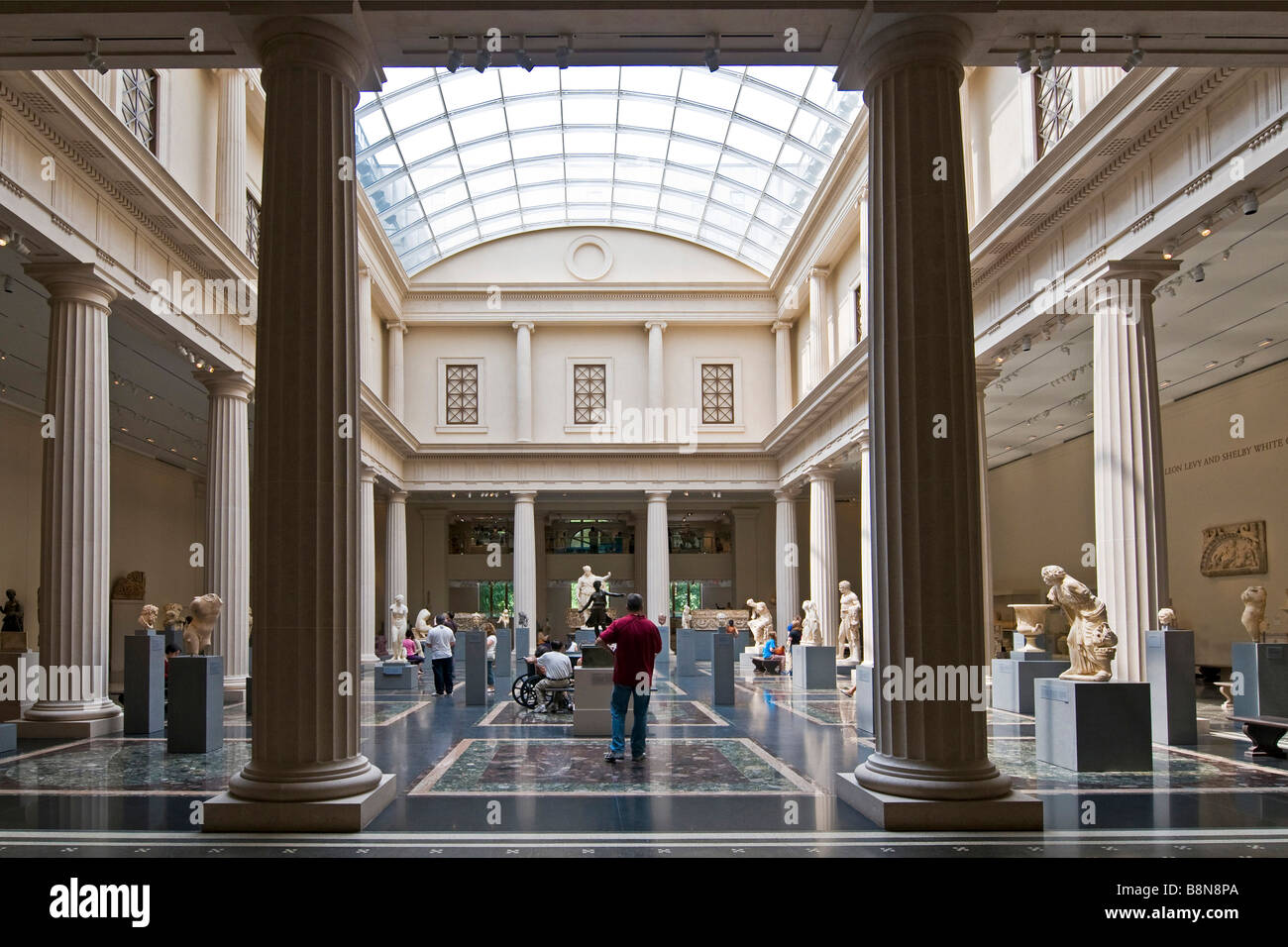 Classical marble sculpture set amongst roman columns, Metropolitan Museum of Art Stock Photo