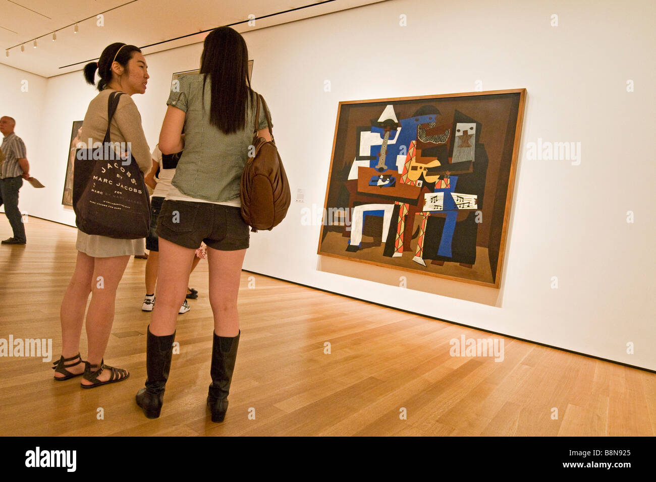 Visitors viewing a painting at the Museum of modern art Stock Photo