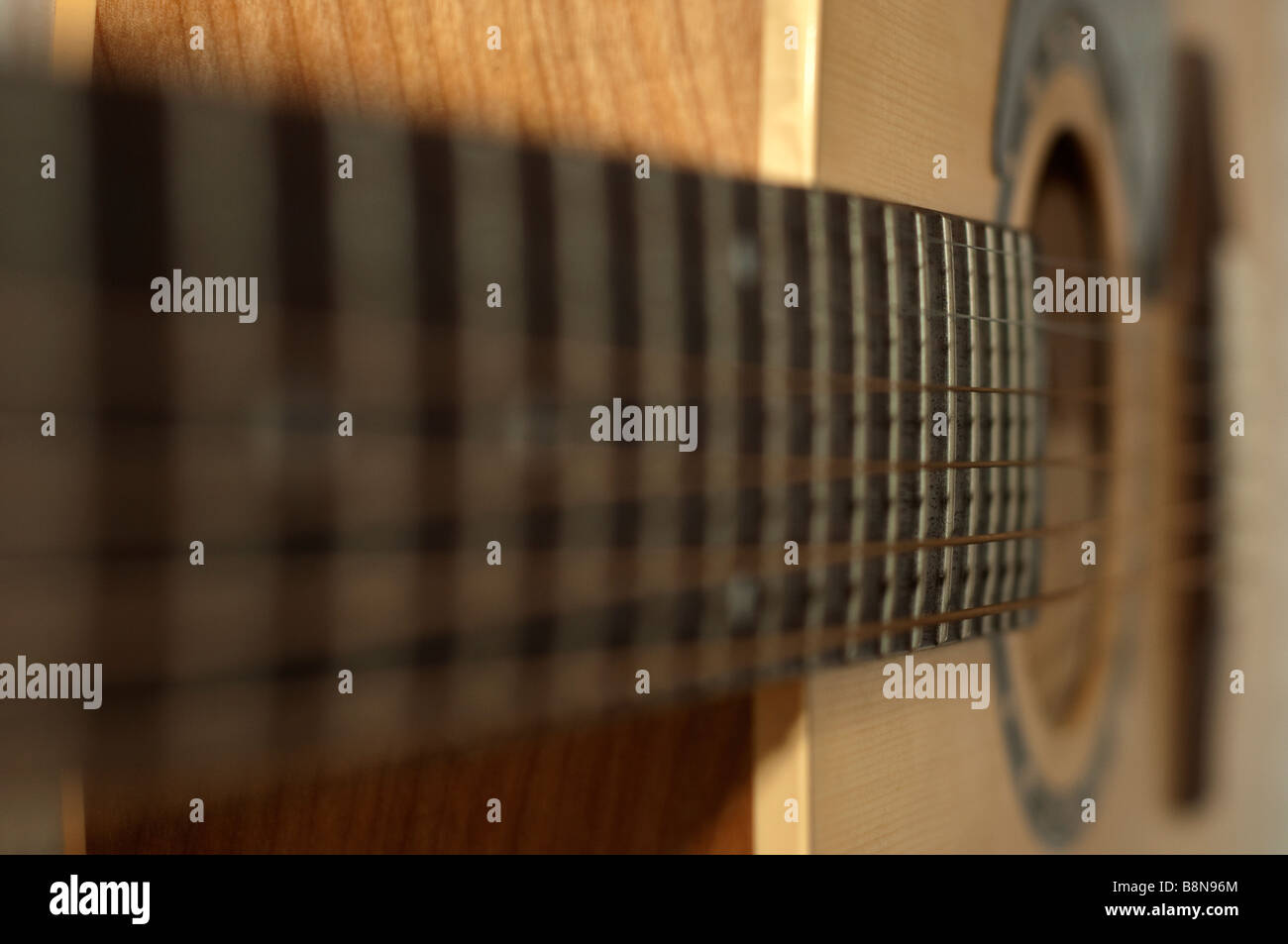 a closse up of guitar and strings Stock Photo