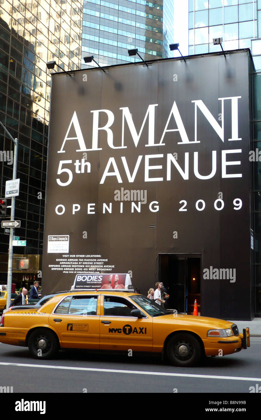 Yellow taxi cab outside the site of new Armani store on 5th avenue Stock Photo