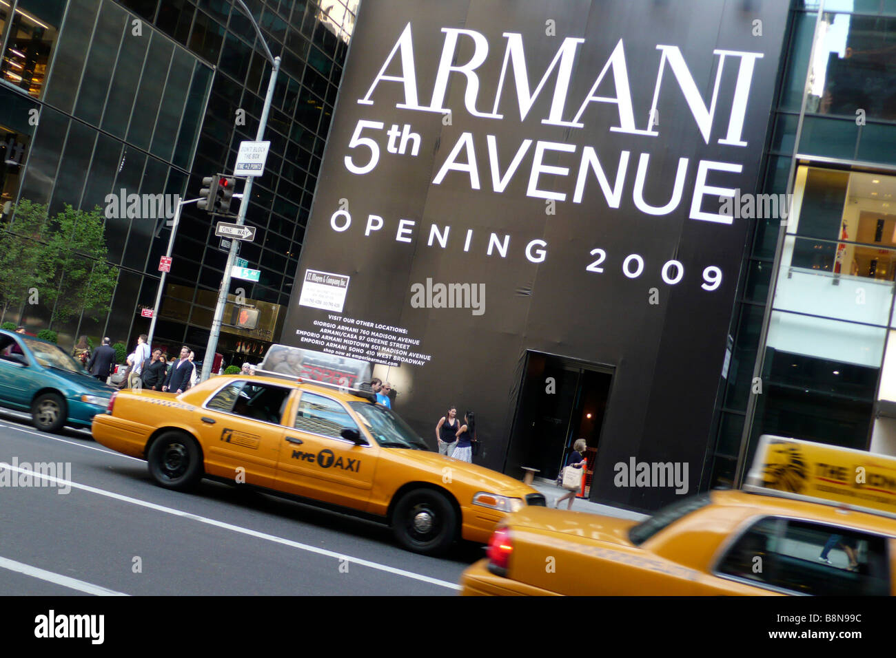 Yellow taxi cabs outside the site of new Armani store on 5th avenue Stock Photo
