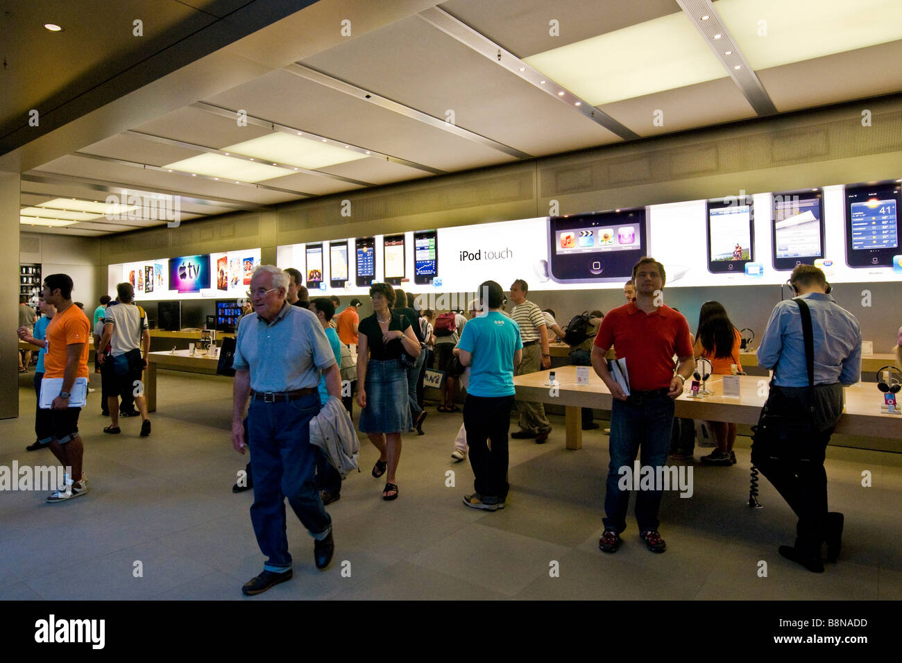 Shoppers inside the Apple Mac store on 5th avenue Stock Photo