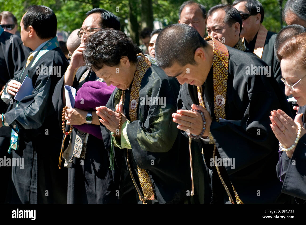 Japanese tourists attending a memorial ceremony remembering the September 11 tragedy Stock Photo