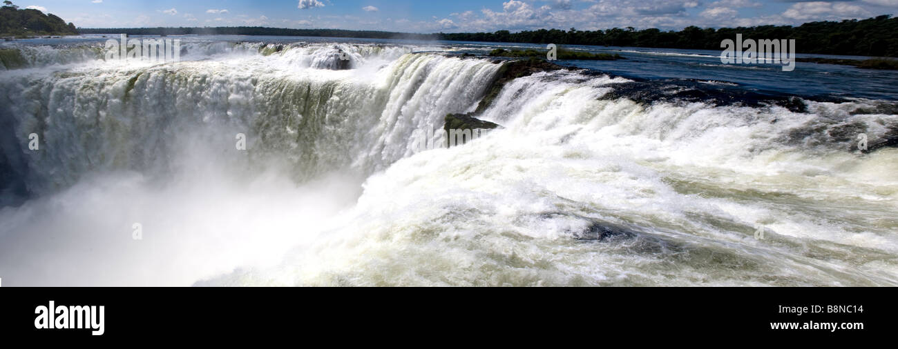 Panoramic view of water gushing down Devil's Throat- Iguazu Water Fall, Argentina Stock Photo