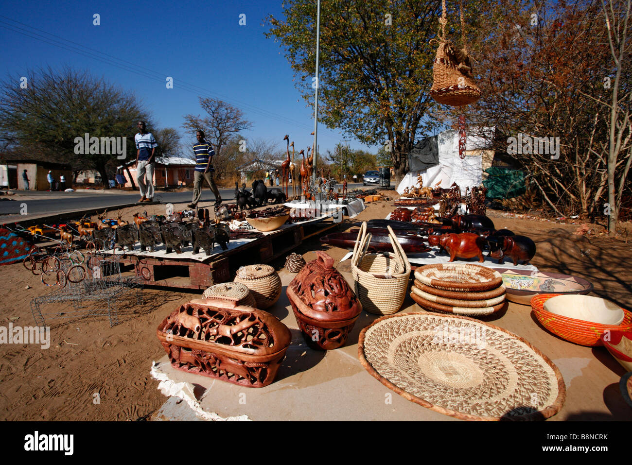 Curios for sale at a roadside stall in Kasane Stock Photo