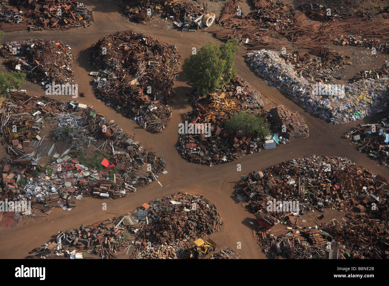 Aerial view of a junk yard with large piles of scrap metal Stock Photo