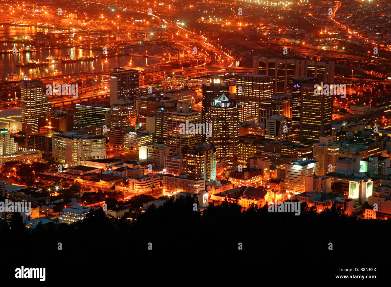 A view of Cape Town CBD at night showing the harbour and the brightly lit convention centre Stock Photo