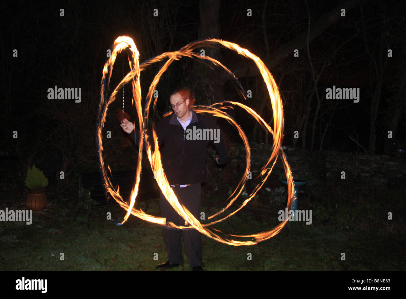 British man demonstrating Fire Poi Stock Photo