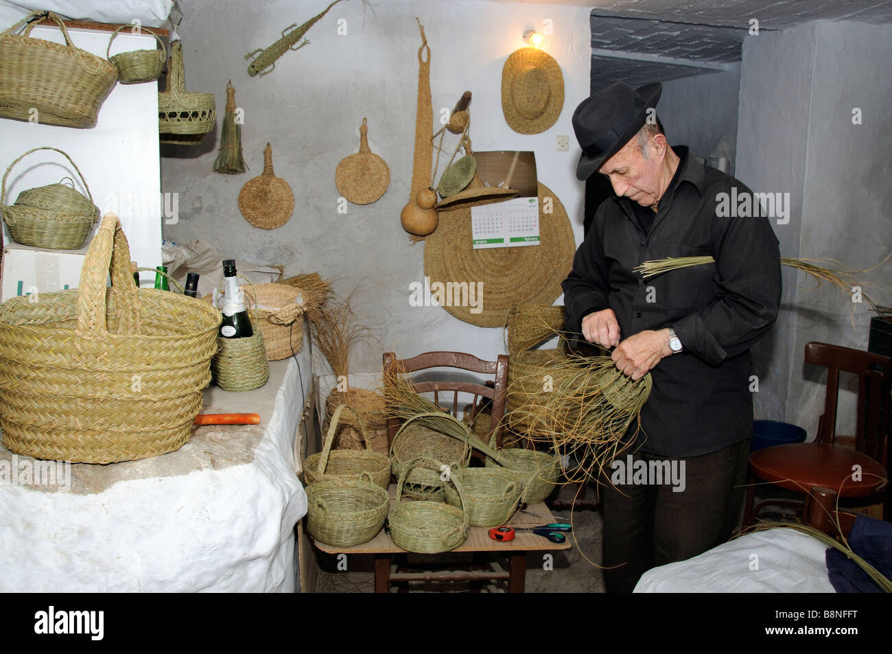 Weaving esparto grass to make baskets a spanish craftsman working in