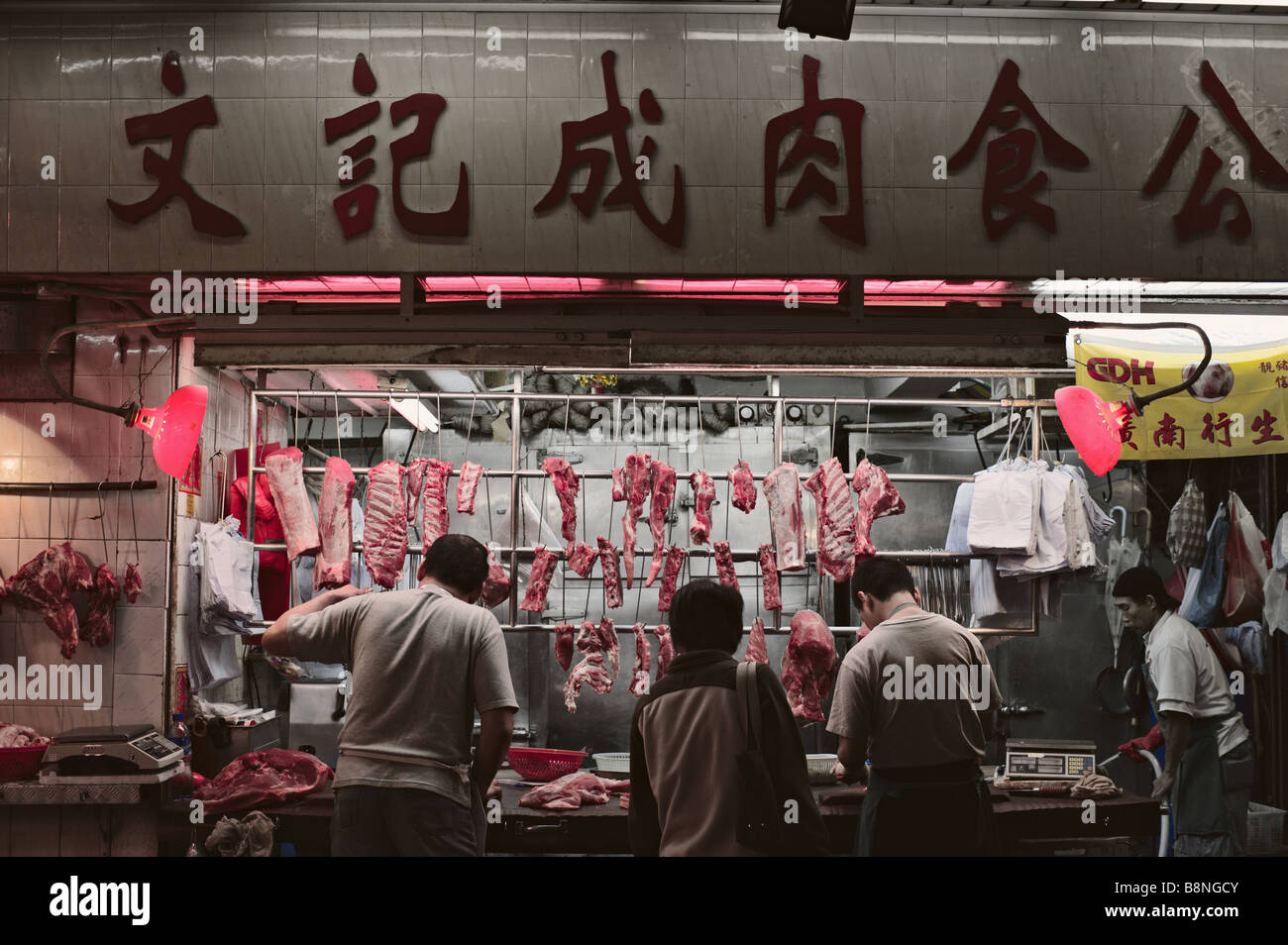 Butcher shop at night Gage Street wetmarket Hong Kong Stock Photo