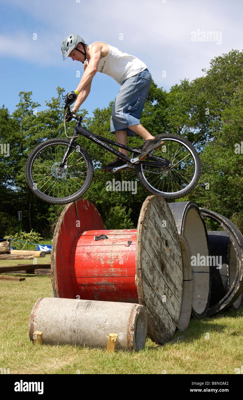 Mountain bike stunts at the Motorcycle World Event, Beaulieu, Hampshire, UK Stock Photo