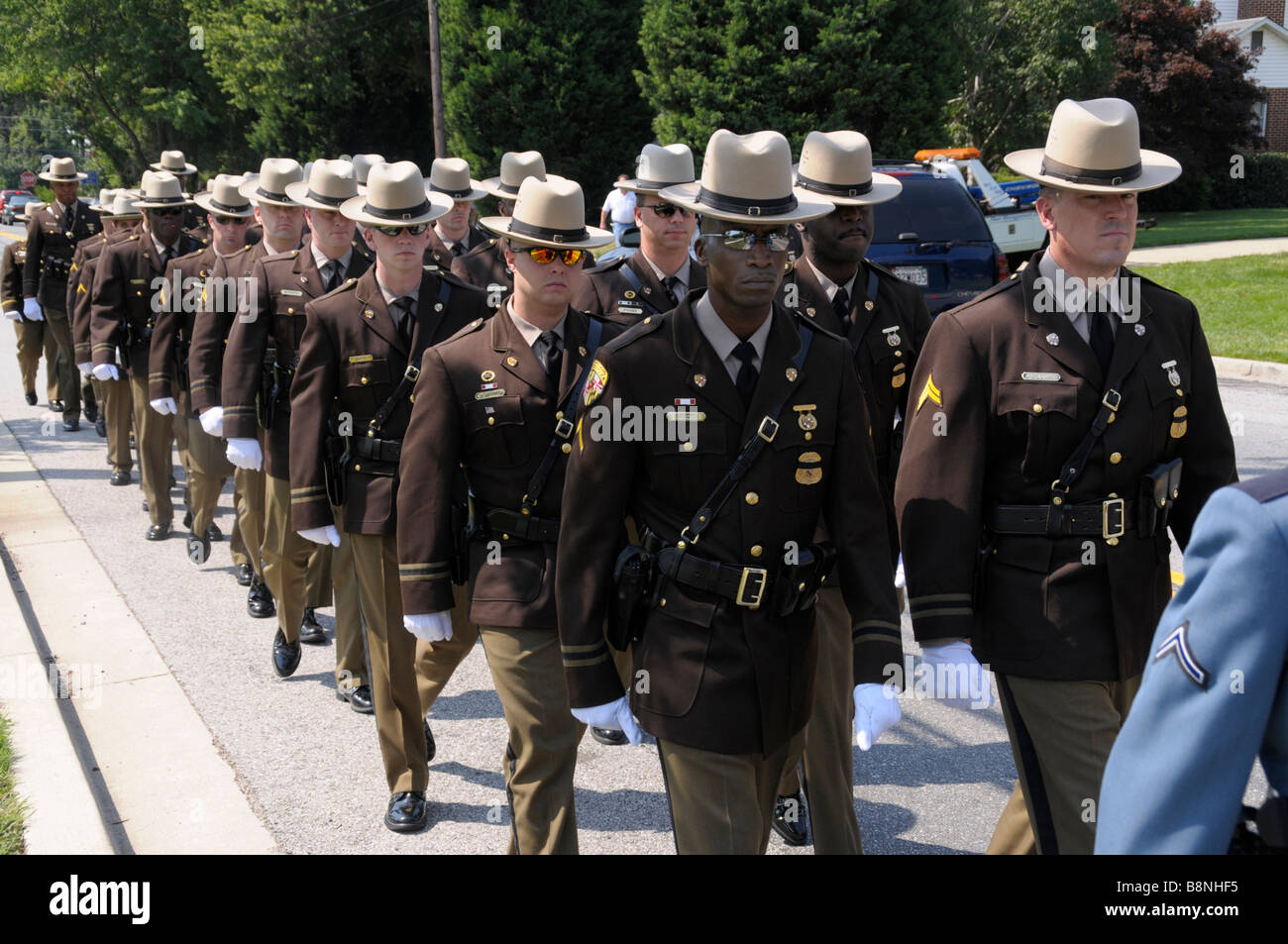 Maryland State police march to church in Beltsville, Md where funeral for a policeman who was killed by a suspect will be held Stock Photo