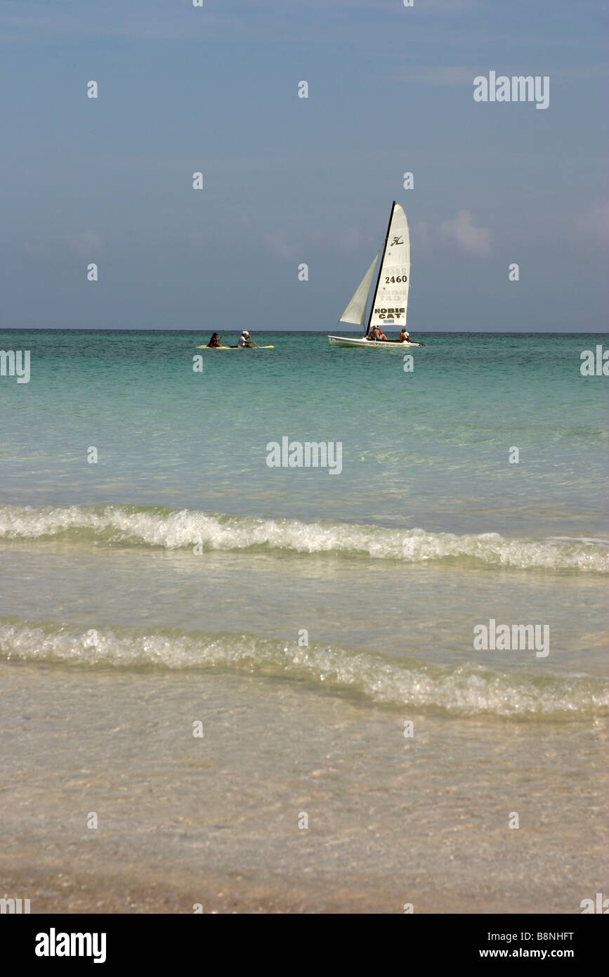 Single sailing pleasure yachtand canoe, caribbean sea, cuba Stock Photo