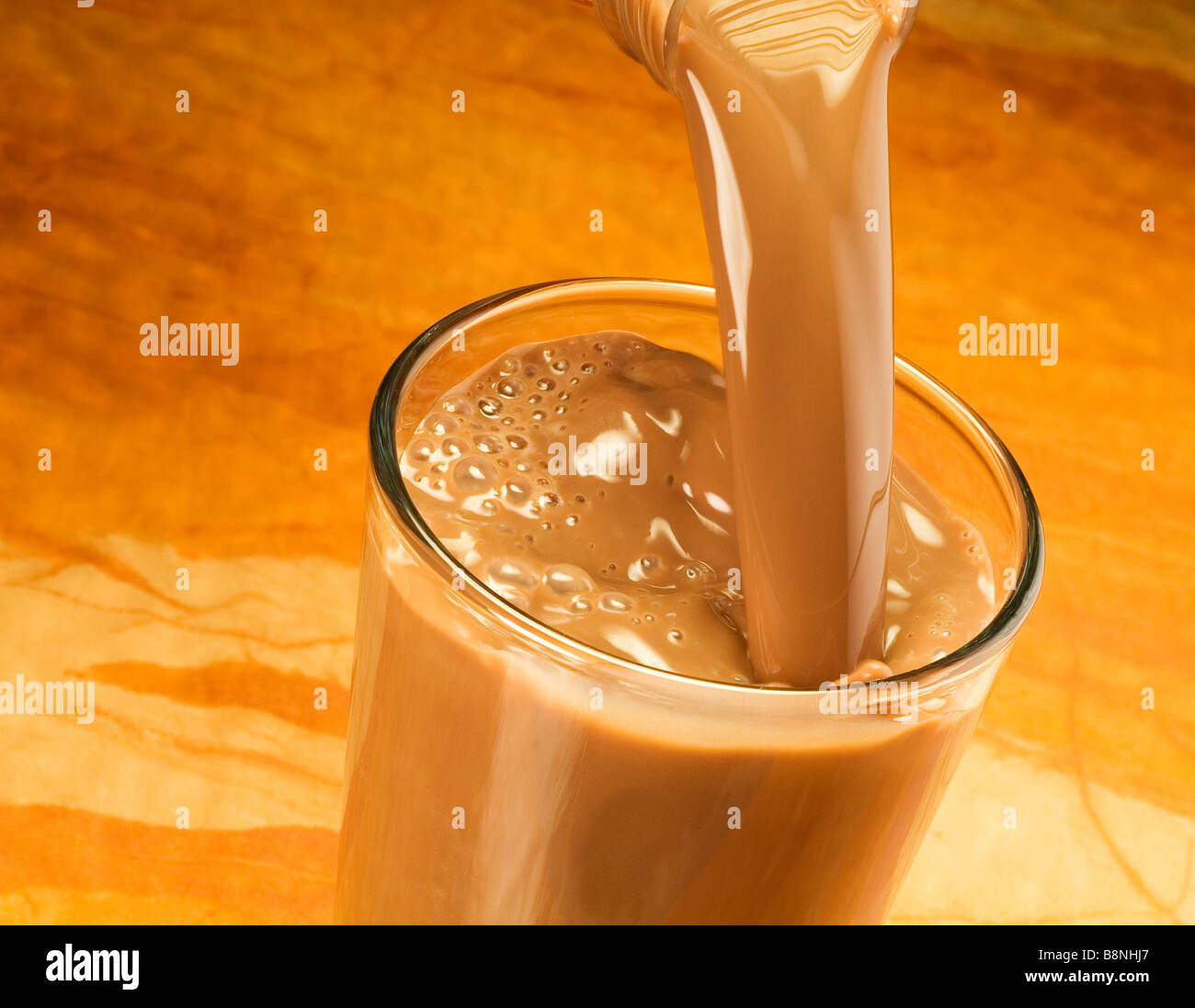 Pouring chocolate milk Stock Photo Alamy