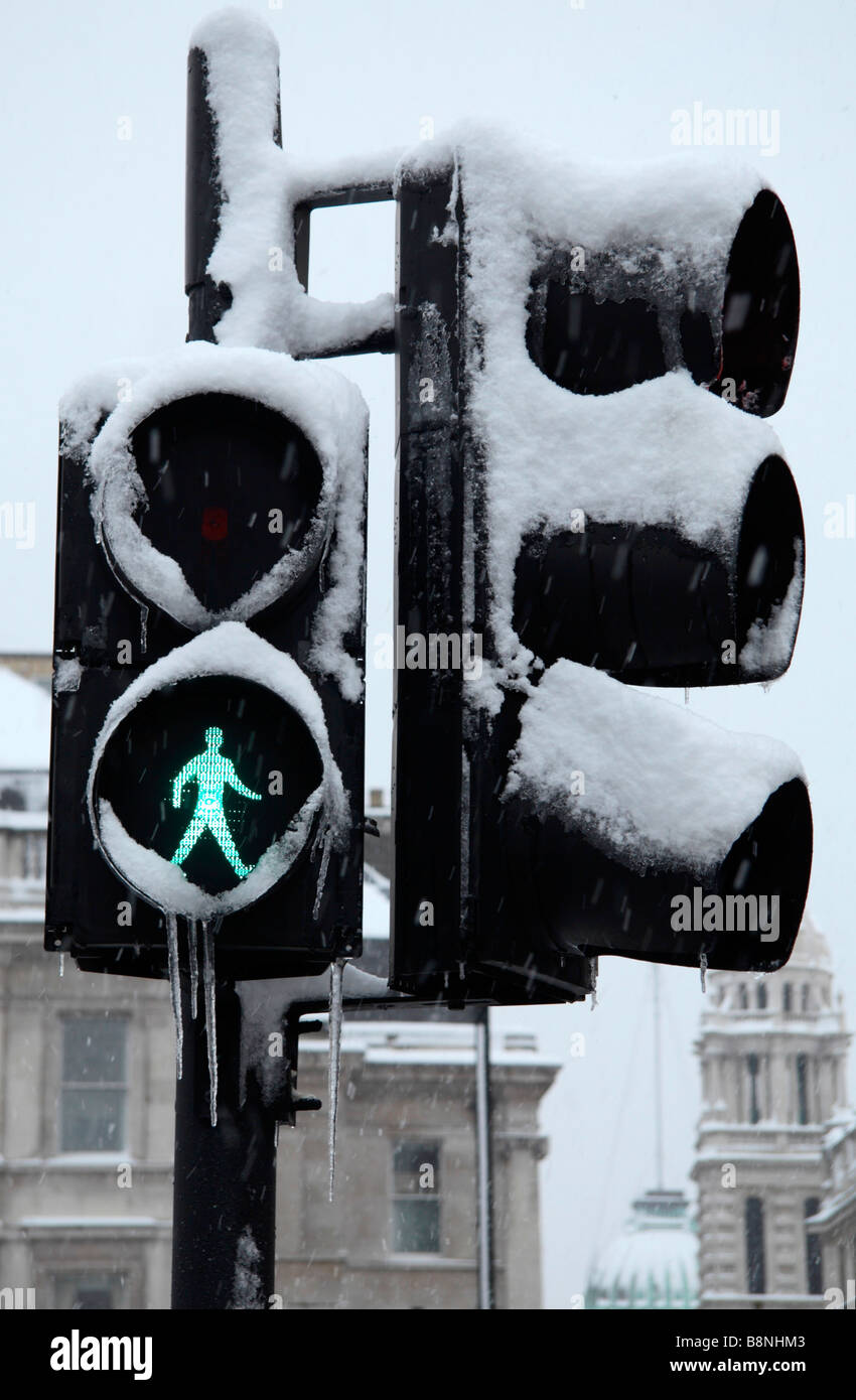 Snow & ice covered traffic & pedestrian crossing lights in Trafalgar Square, London during the snow storm of 2nd February 2009. Stock Photo